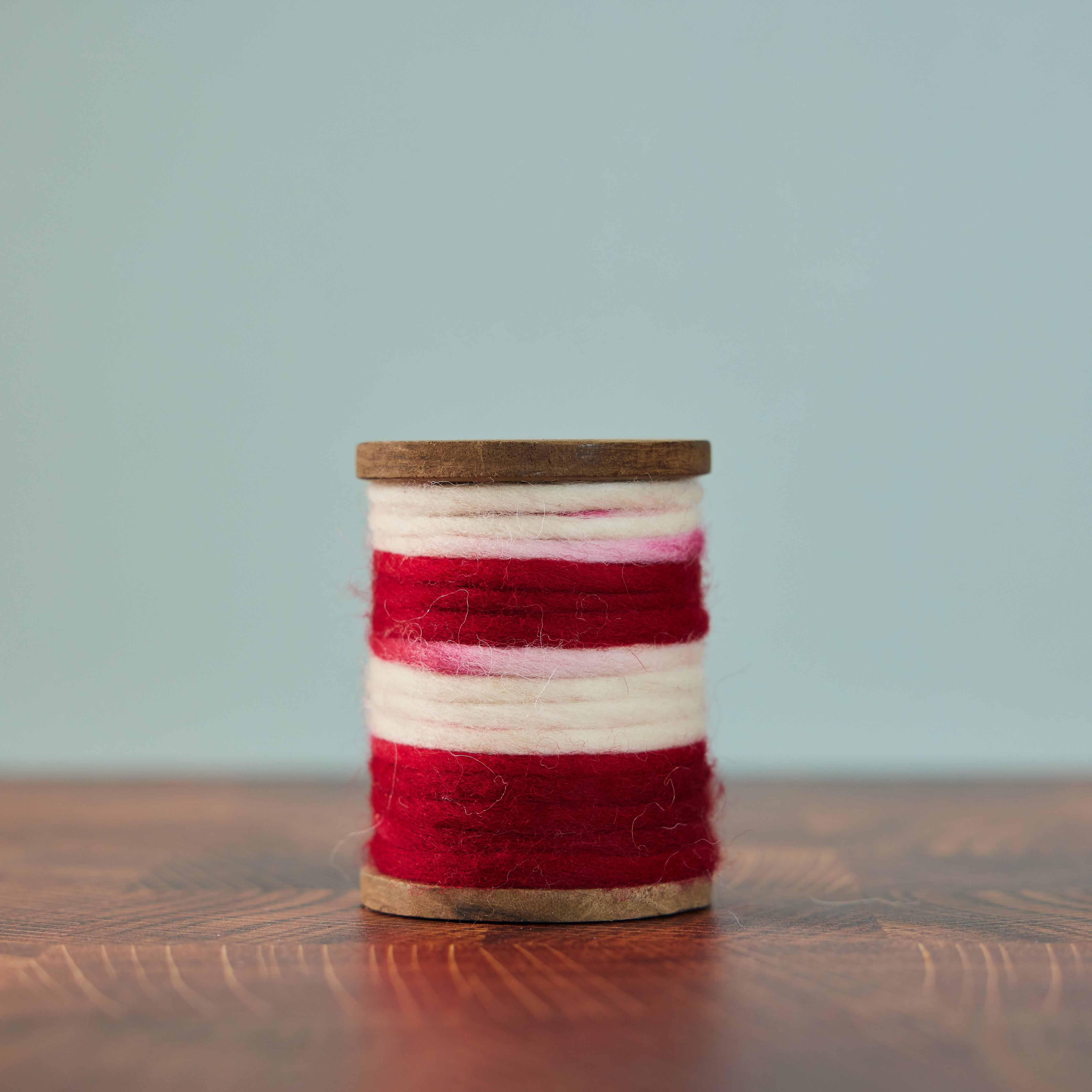 Red and Cream Spool of Wool | 80 Acre Market β 80AcreMarket.com